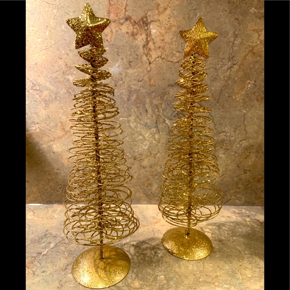 2 gold colored glittery Christmas trees
